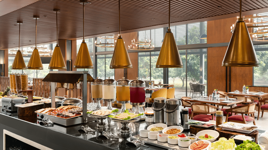 Buffet counter with live stations and pendant lighting at Wyndham Garden.