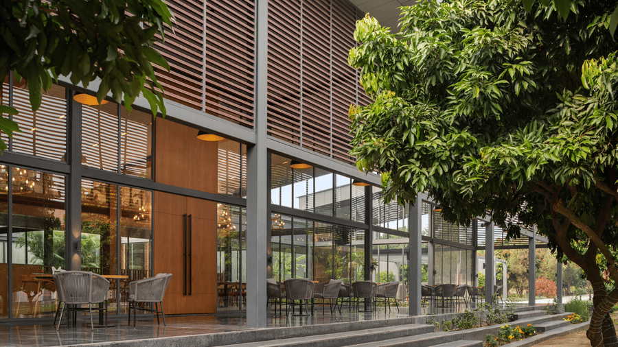 Contemporary glass façade and landscaped entrance at Wyndham Garden.