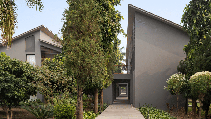 Modern glass façade and landscaped exterior view at Wyndham Garden.