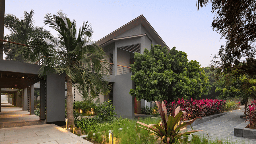 Contemporary villa exterior with lush gardens at Wyndham Garden.