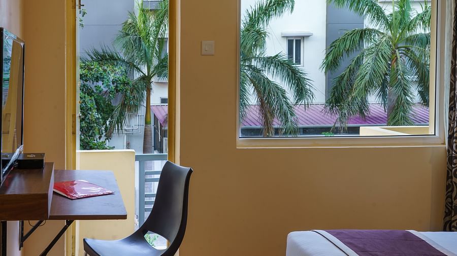 Room with study area, door and wide window at Wyt Hotels, Rameswaram