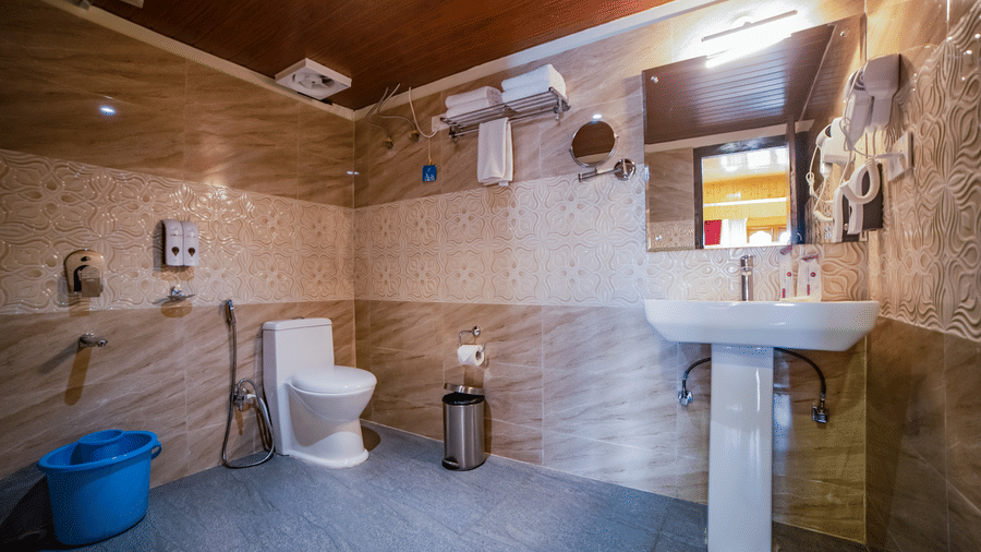 Yashshree, Lachung elegant washroom interior showcasing a sleek vanity unit, mirror lighting, hygienic fittings and calm neutral tones for a refreshing experience