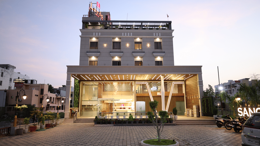The illuminated facade of Lords Inn Sangam, Bhopal a modern multi-storey hotel.