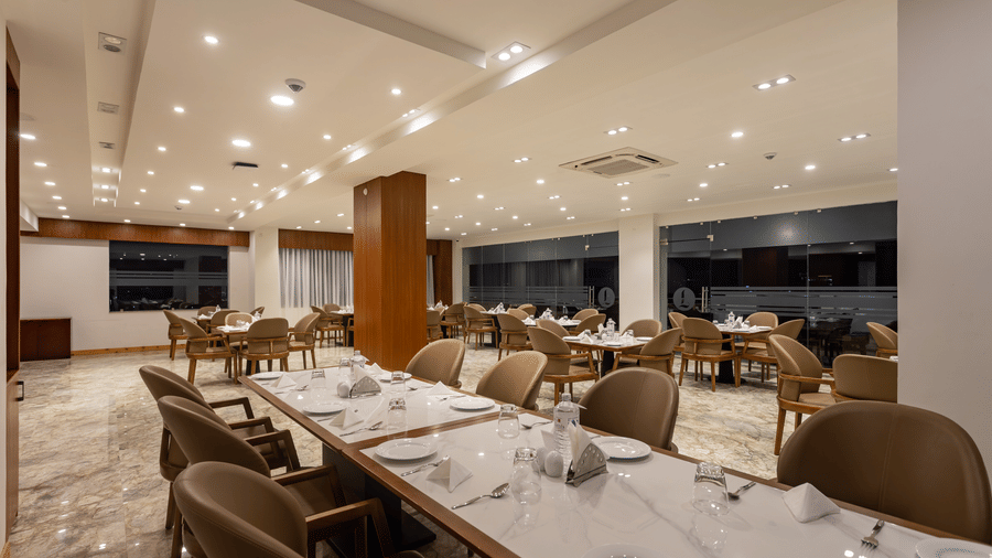 The Blue Coriander restaurant at Mandala Norling Lords Prime in Kathmandu featuring a fine dining seating arrangement and well-placed cutlery.
