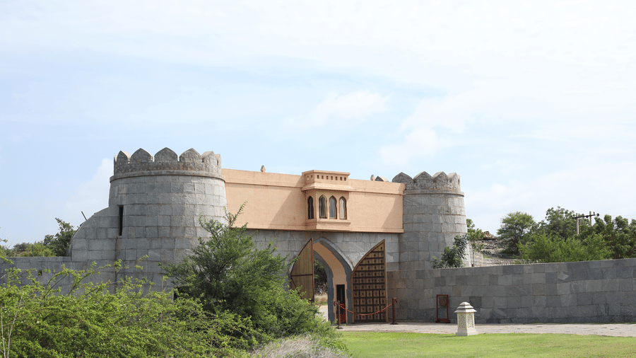 Ancient stone fort entrance and battlements near Evolve Back Hampi