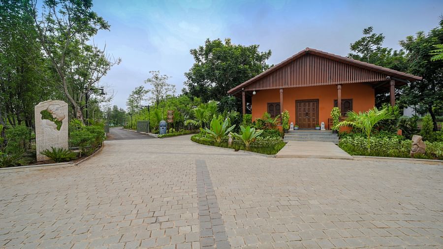 A facade image of a pathway leading to a cottage at the resort - Trance Veechika Resort, Vikarabad
