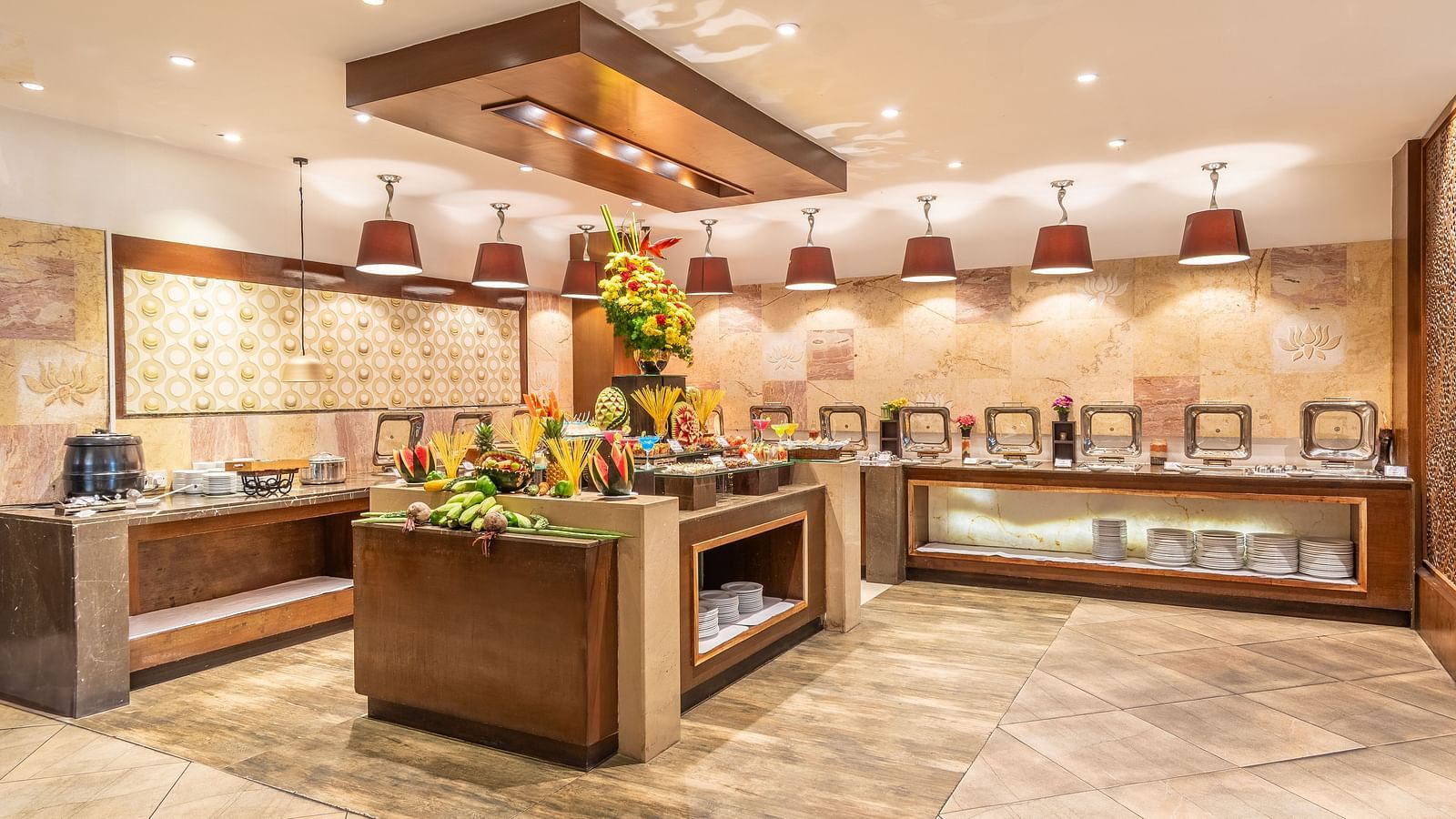 Buffet counter in a hotel restaurant decorated with fresh flowers- TGI Grand Fortuna, Krishnagiri Main Road, Hosur