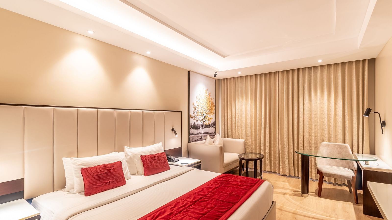 Spacious hotel room with double bed, work desk, and armchair - TGI Grand Fortuna, Krishnagiri Main Road, Hosur