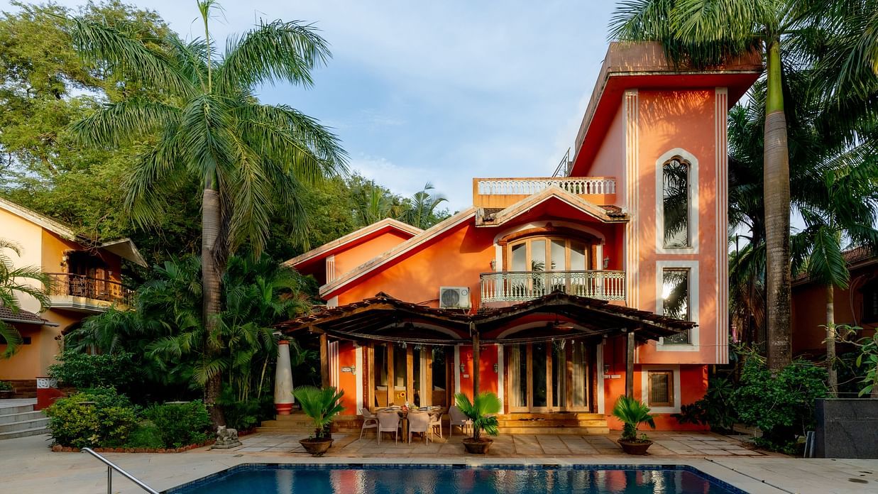 Image featuring the facade of Casa Arya Villa, Candolim with a pool in front of it