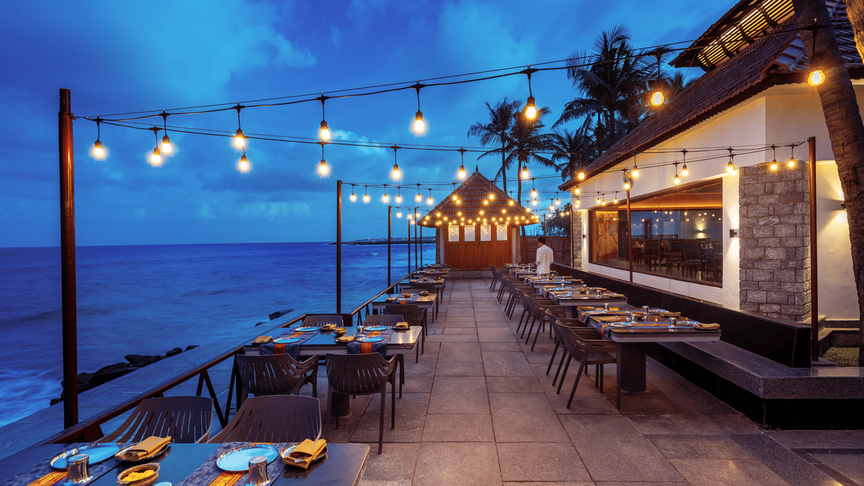 MGM Sea Crest Southern Sojourn Restaurant by the beach with tables and chairs aligned neatly at MGM Beach Resorts.