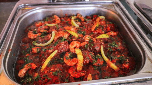 A prawn dish with some vegetables.