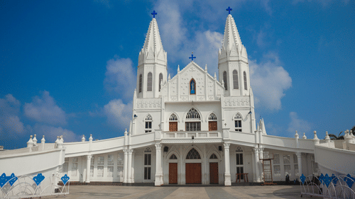Velankanni Church in Tamil Nadu featuring two storey building and tall extensions on both side of the main building.