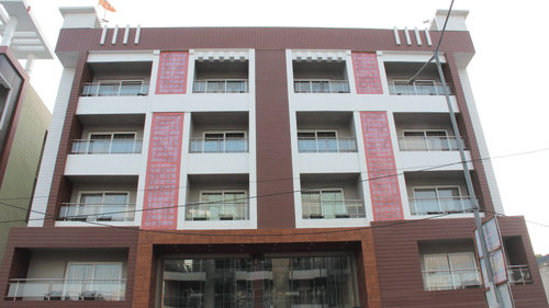 A facade view of Pride Biznotel Canopus Digha featuring four storeys and a main gate which is an entrance