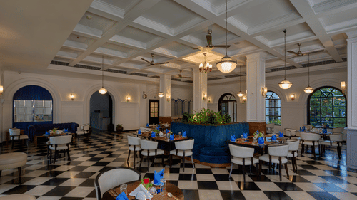 Best Restaurant in Fort Kochi - elegant dining hall with checkered floor and colonial-style interiors at The Old Court House.