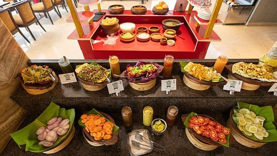 Salads arranged on the table at Icon Premier Hotel by Bhagini, Devarabisanahalli
