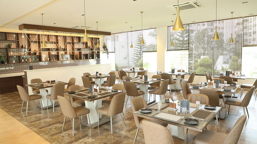 Brown tables and chairs in a restaurant dining area