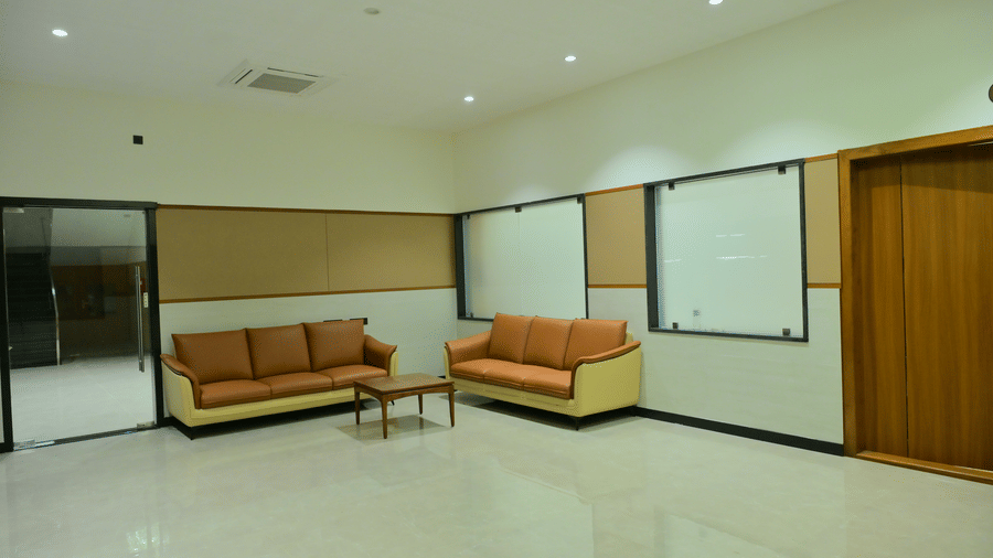 Lounge area of Bhavanis Vista By Icon featuring armchairs and a coffee table.