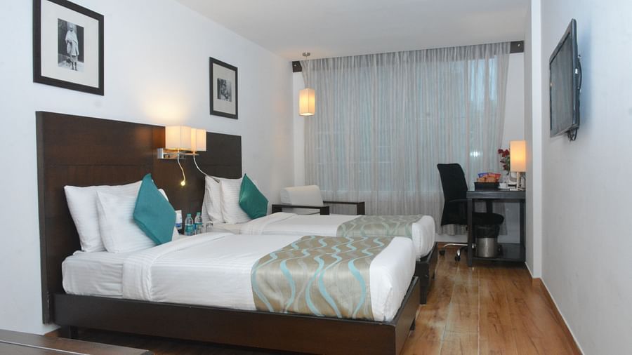 Side angle view of the room with twin bed and amenities - Clarks Collection, Vadodara