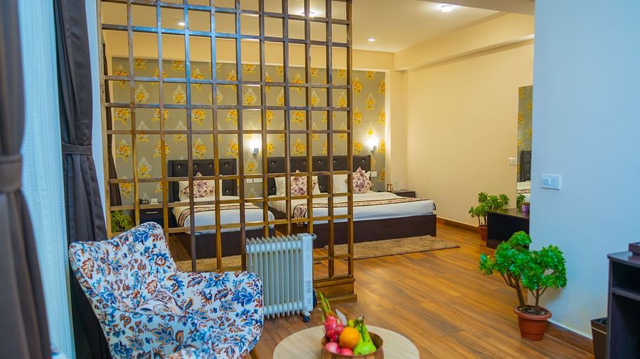 Dream Villa Retreat, Pelling - The interiors of the Suite in our hotel with a colourful lounge chair kept in the living area