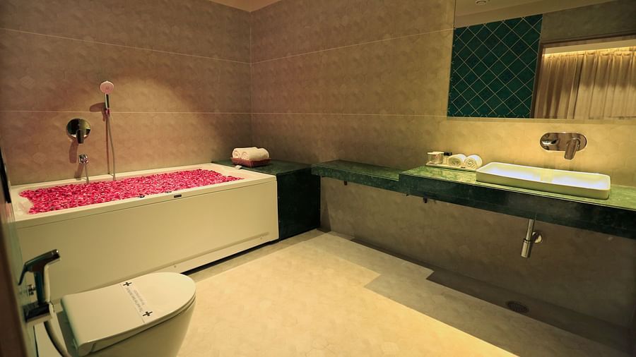 the bathtub filled with rose petals at the suite's washroom - Hotel Bawa, Udaipur