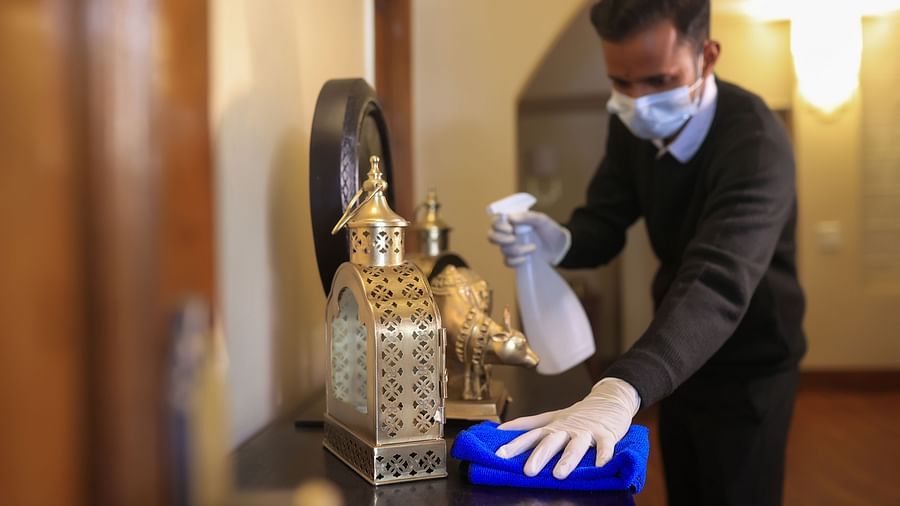 Hotel staff cleaning the room - Lamrin Boutique Cottages Rishikesh