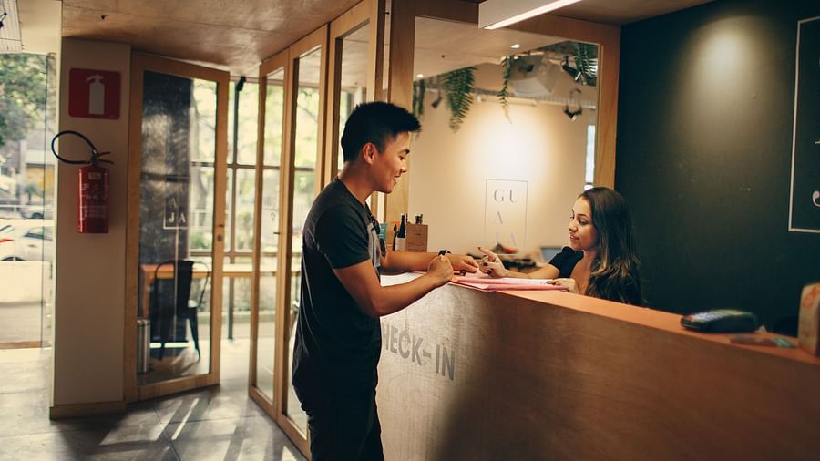 Lime Tree Hotel Golf Course Extension Road Gurgaon- A person checking themselves into a hotel