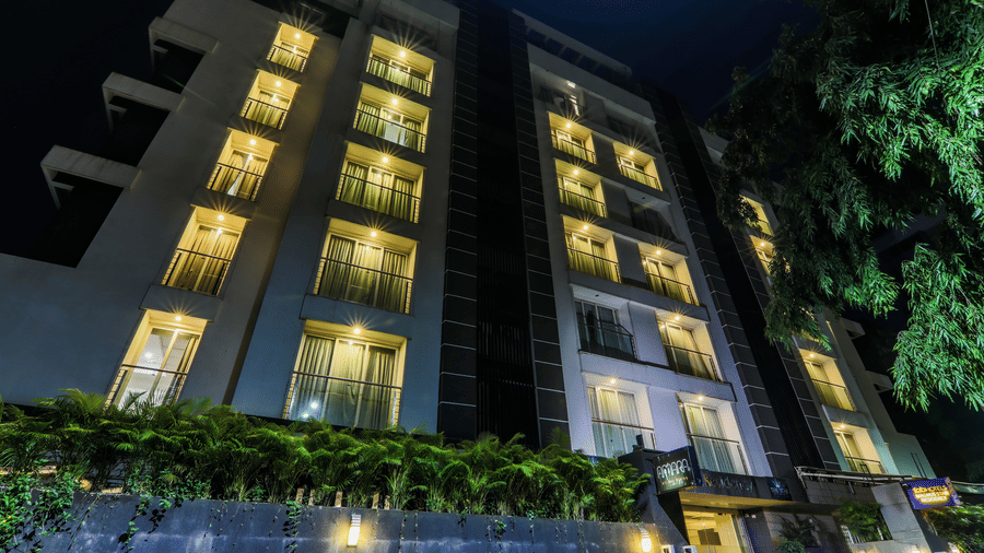 The night view of the hotel building with illuminated windows Magnus Star.