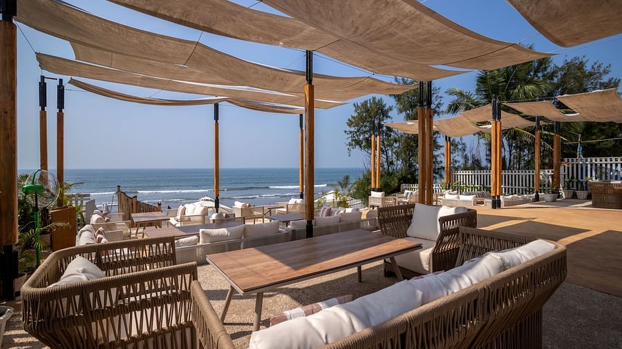 full view image of the saz on the beach restaurant at sibaya beach resort, morjim beach with covered seating arrangements