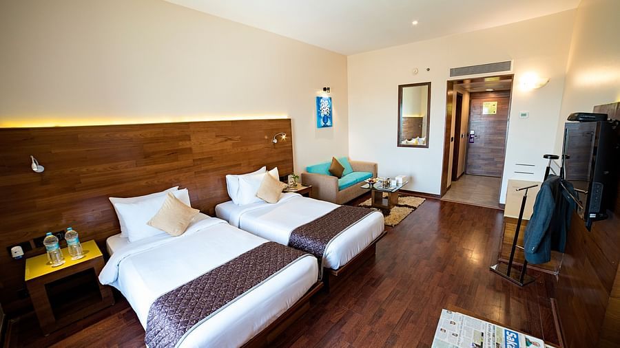 a full view of a room with bed and sofa 4 - The Orchid Hotel Pune