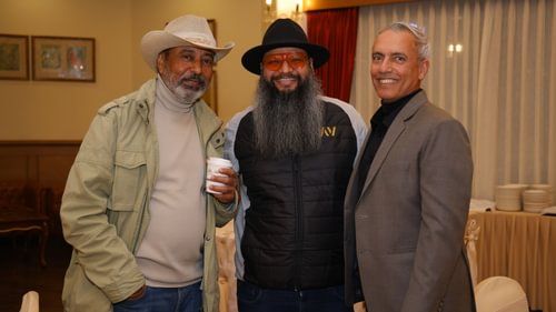 A group of senior citizen posing for the camera at an event at Heritage Village Resorts & Spa