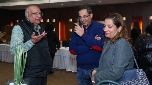 Three people gathered and are talking about something in an event at Heritage Village Resorts & Spa