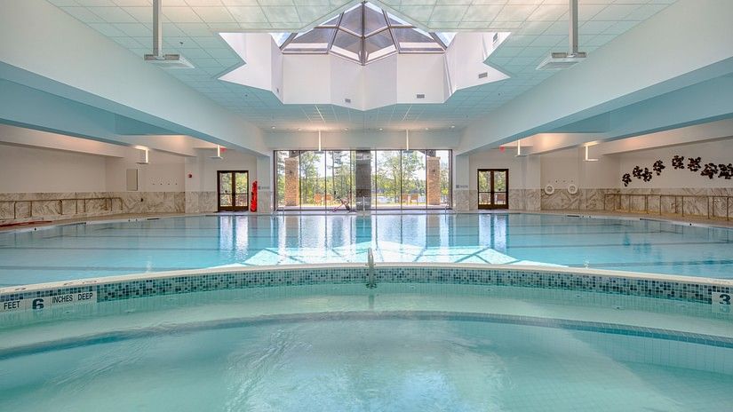 Spacious indoor swimming pool with natural light at YO1 Health Resort, Catskills, New York.
