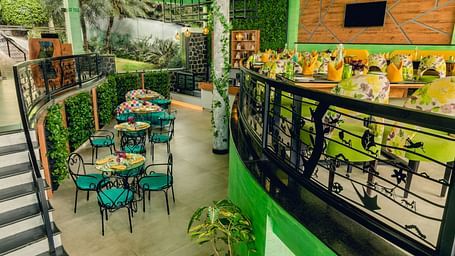 An image of a restaurant with seating arrangement at Great Trails Yercaud by GRT Hotels