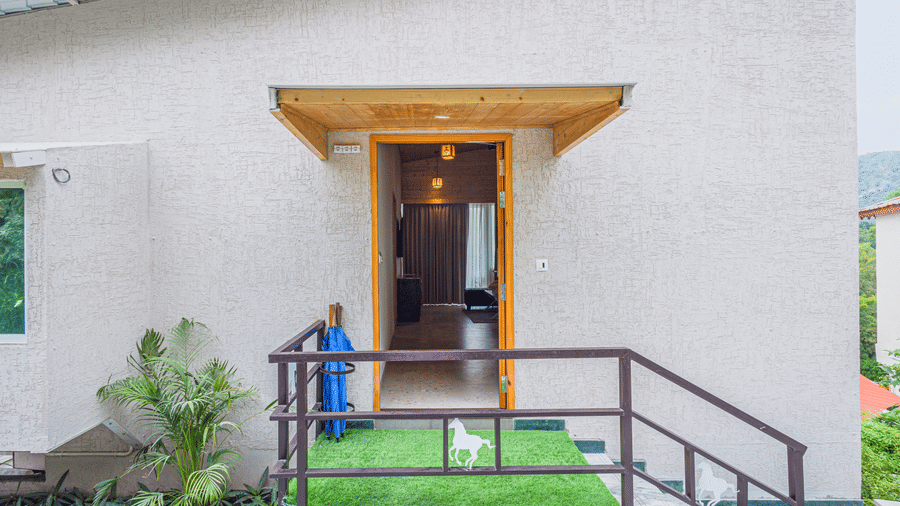 Entrance of Sajjan Villa at Bamboo Saa Resort and Spa, Udaipur featuring stairs leading to a room.