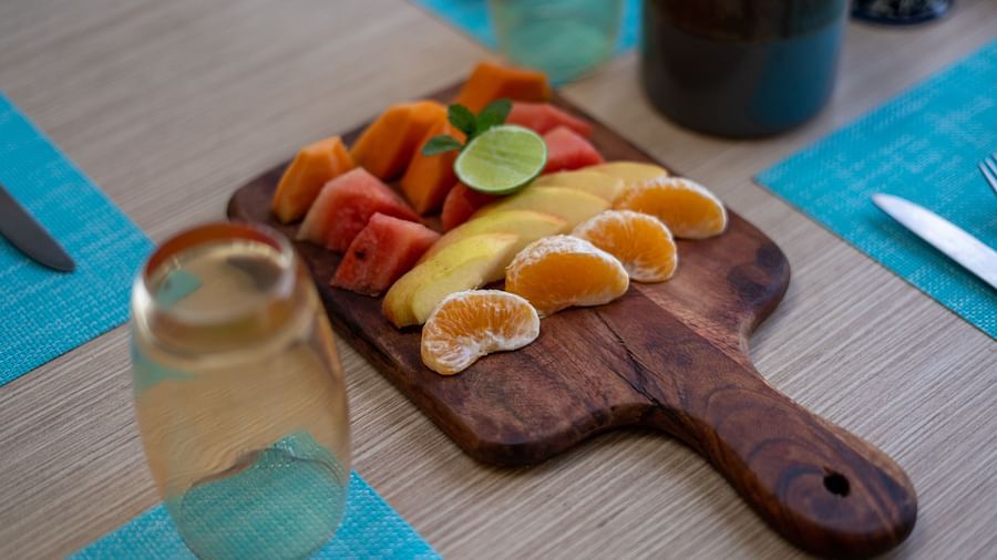 A variety of sliced fruits neatly arranged for serving at BluSalzz Escapade Resort, Lansdowne.