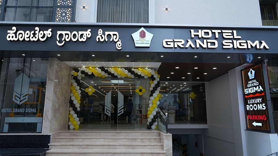 facade image of our hotel with the a slope leading towards the parking area - Hotel Grand Sigma