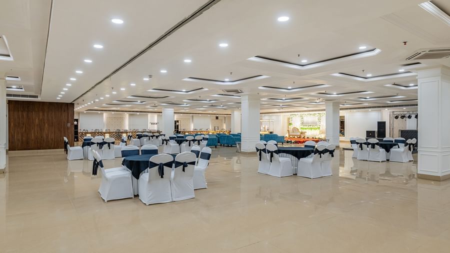 Banquet hall with cluster seating arrangement and open space ideal for social gatherings at Hotel Highway King, Bilaspur.