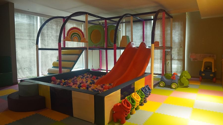 Kids play area featuring slides and a ball pit.