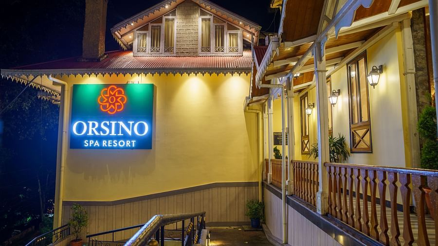The exterior of Orsino Spa Resort with warm lighting and visible architectural details.