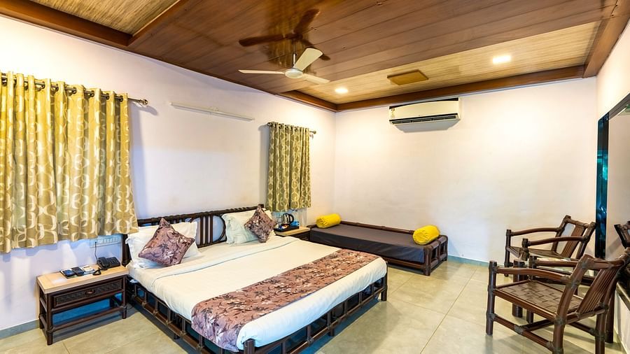 A room with with a double bed and seating arrangement at Saavaj Resort
