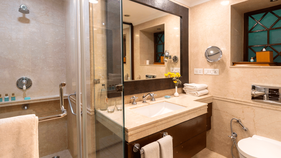 image of a bathroom with a cubical shower at The Claridges Nabha Residence