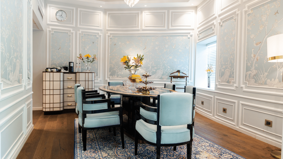 Claridges Suite at The Claridges New Delhi, showcasing a cosy corner dining area adorned with elegant lighting and a fresh flower bouquet