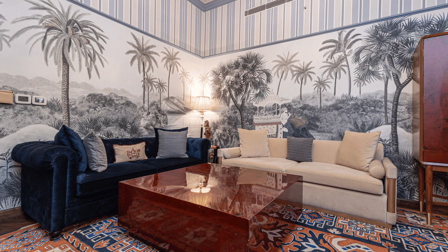 image of the living area in the heritage parlour suite with two couch and a centre table - The Claridges New Delhi