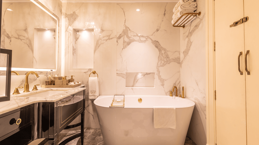 image of a well appointed bathroom with all morder amenities at the heritage parlour suite - The Claridges New Delhi