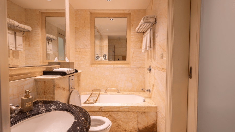 image of a well appointed bathroom with all necessary amenities at our heritage room bathrooms - The Claridges New Delhi