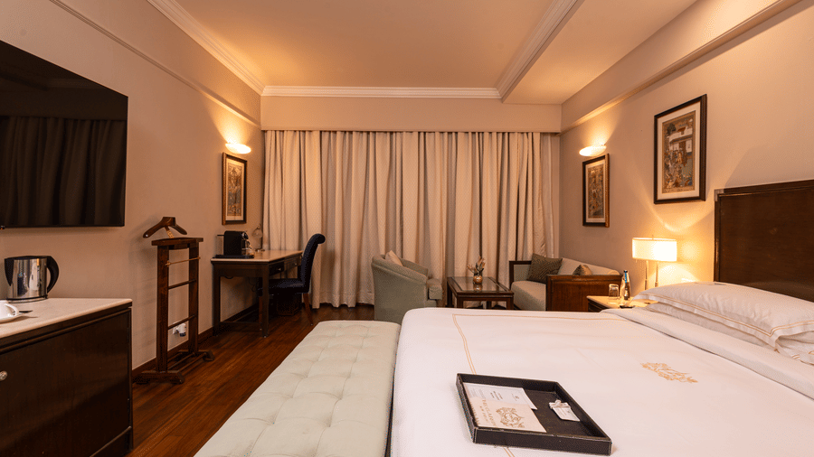 image of the heritage balcony room with sleek interiors and a a plush king size bed - The Claridges New Delhi