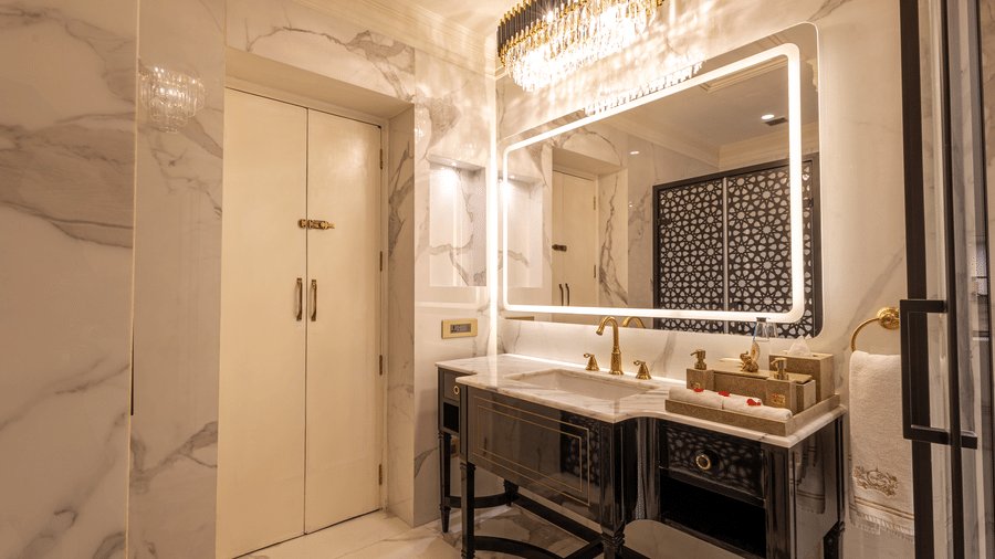 image of the well appointed vanity area along with a mirror with border lighting at the heritage room - The Claridges New Delhi