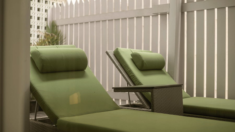 image of the green coloured sun loungers at our heritage luxury suite - The Claridges New Delhi