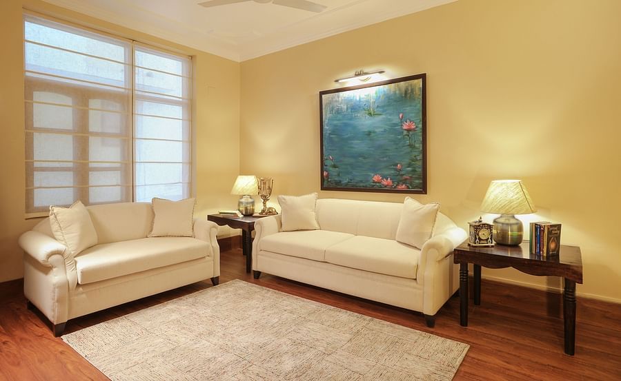 alt-text lounge features white sofas in an airy room - Lamrin Boutique Cottages Rishikesh