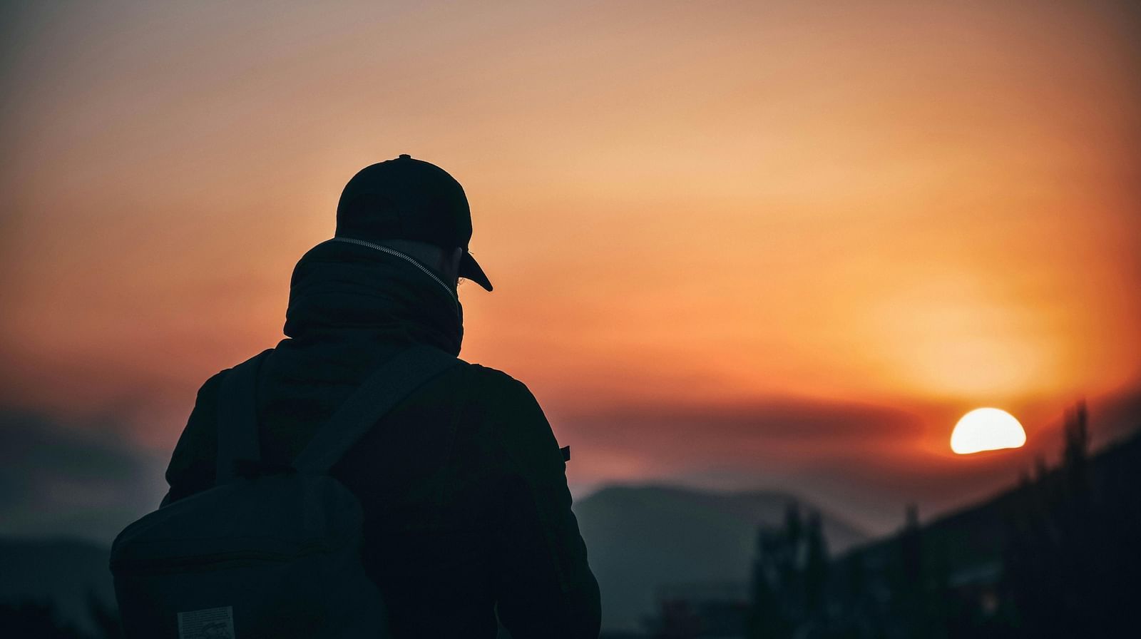 image of a person soaking in the sunset